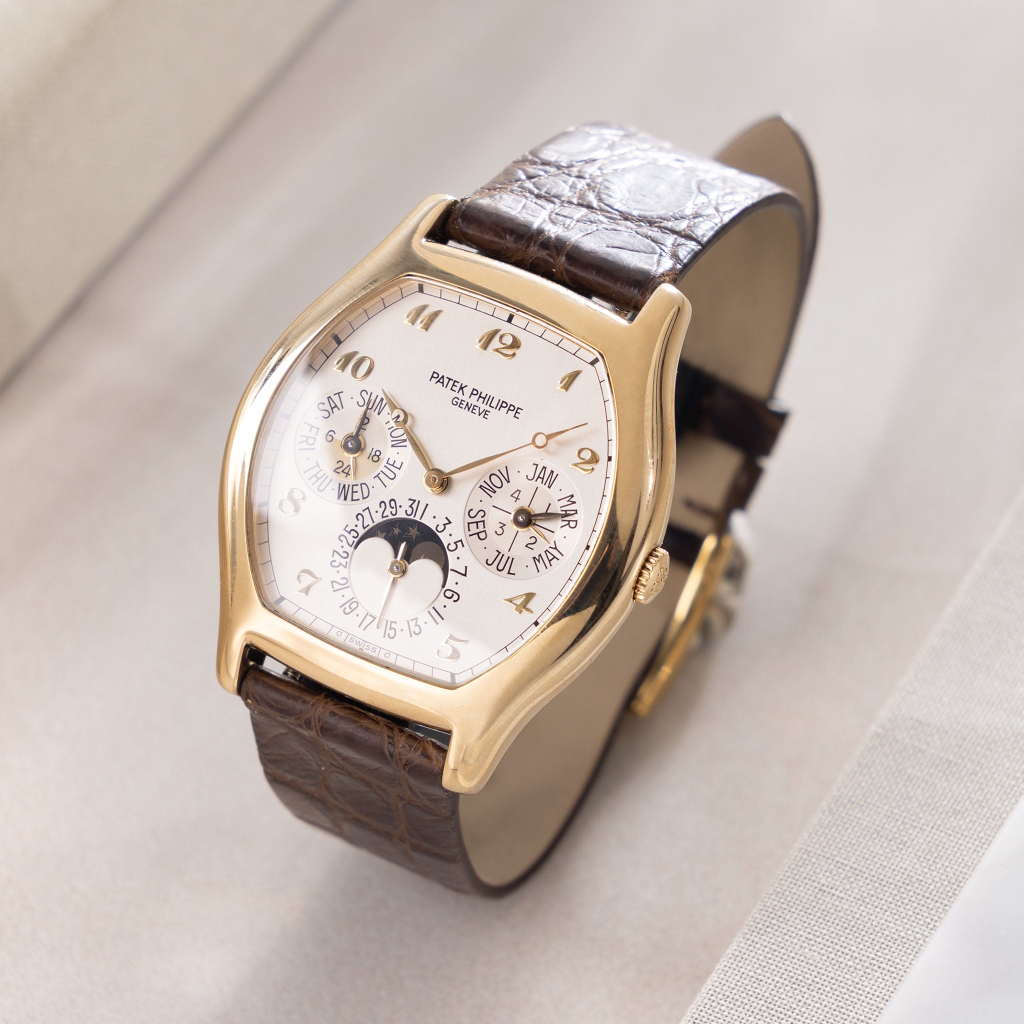 Patek Philippe Perpetual Calendar 5040J in 18k yellow gold Tonneau case with box and papers