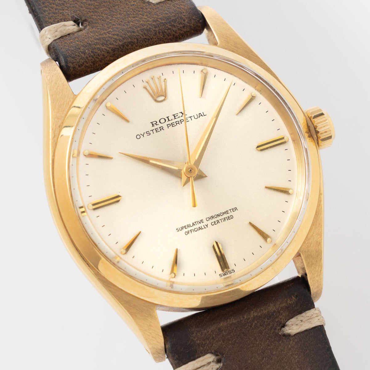 Rolex Oyster Perpetual 1002 Silver Soleil Swiss Only Dial in 18 k yellow gold Coca Cola