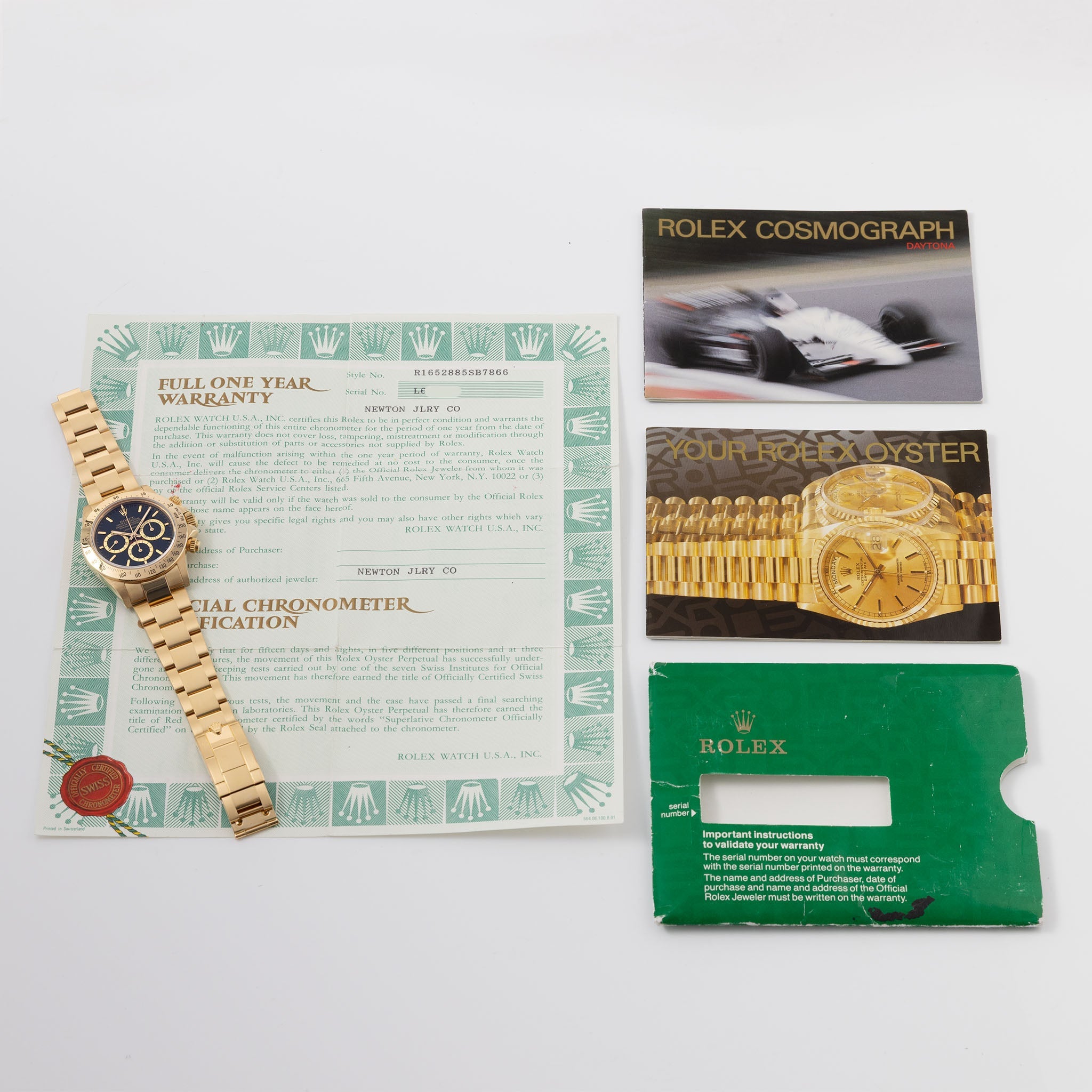 Rolex Cosmograph Daytona 16520 Black Floating Dial in 18k Yellow Gold with Original Guarantee Paper and Accessories