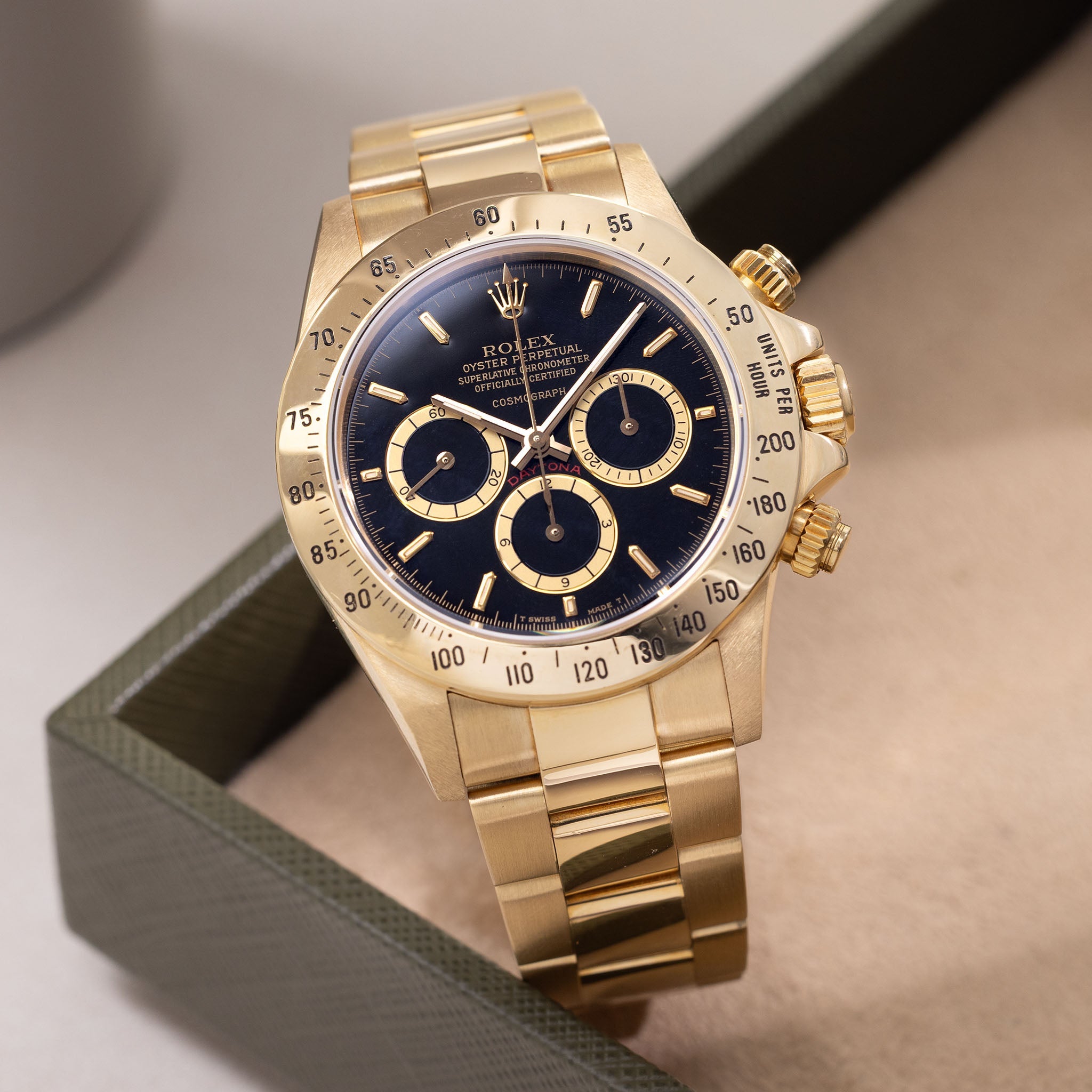 Rolex Cosmograph Daytona 16520 Black Floating Dial in 18k Yellow Gold with Original Guarantee Paper and Accessories