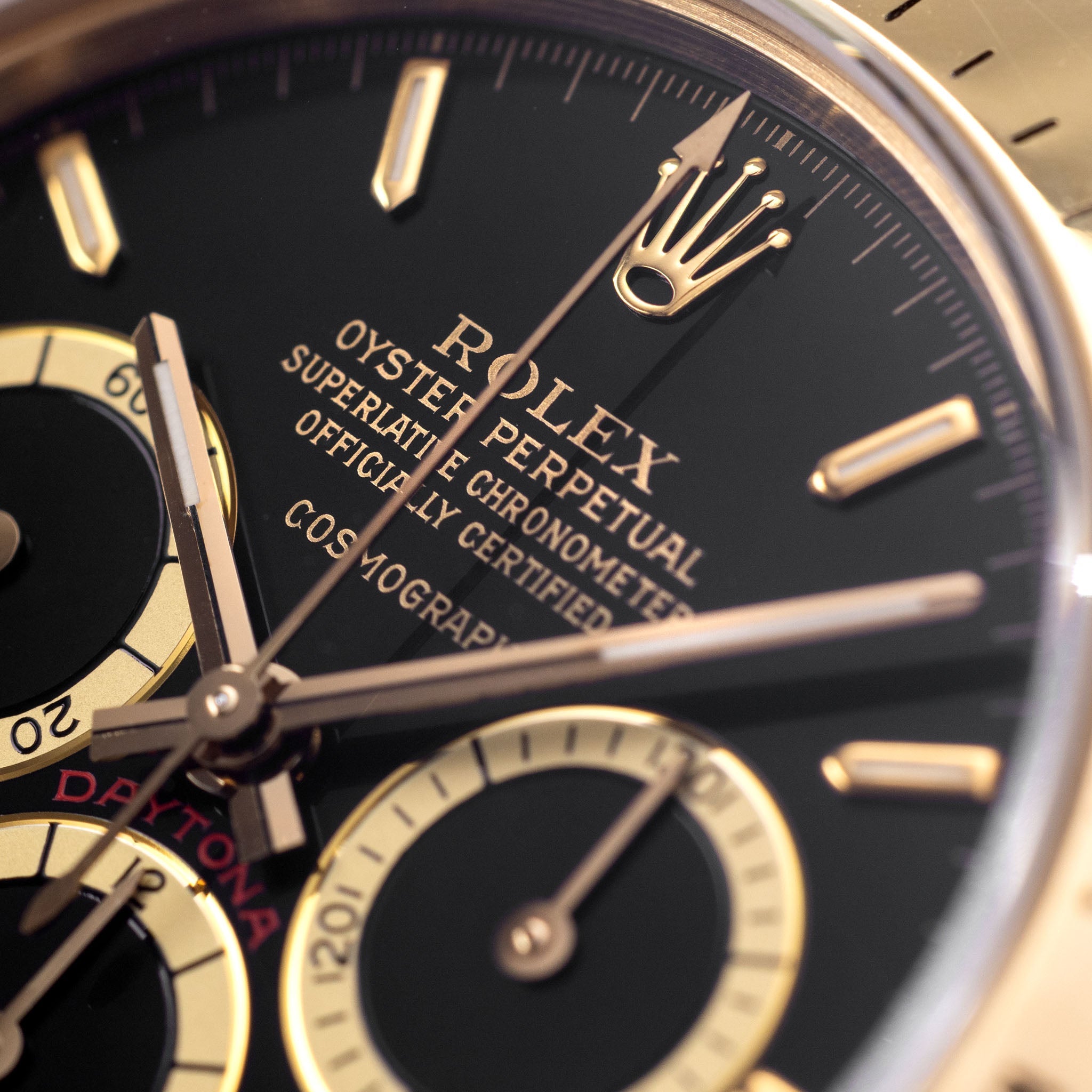 Rolex Cosmograph Daytona 16520 Black Floating Dial in 18k Yellow Gold with Original Guarantee Paper and Accessories