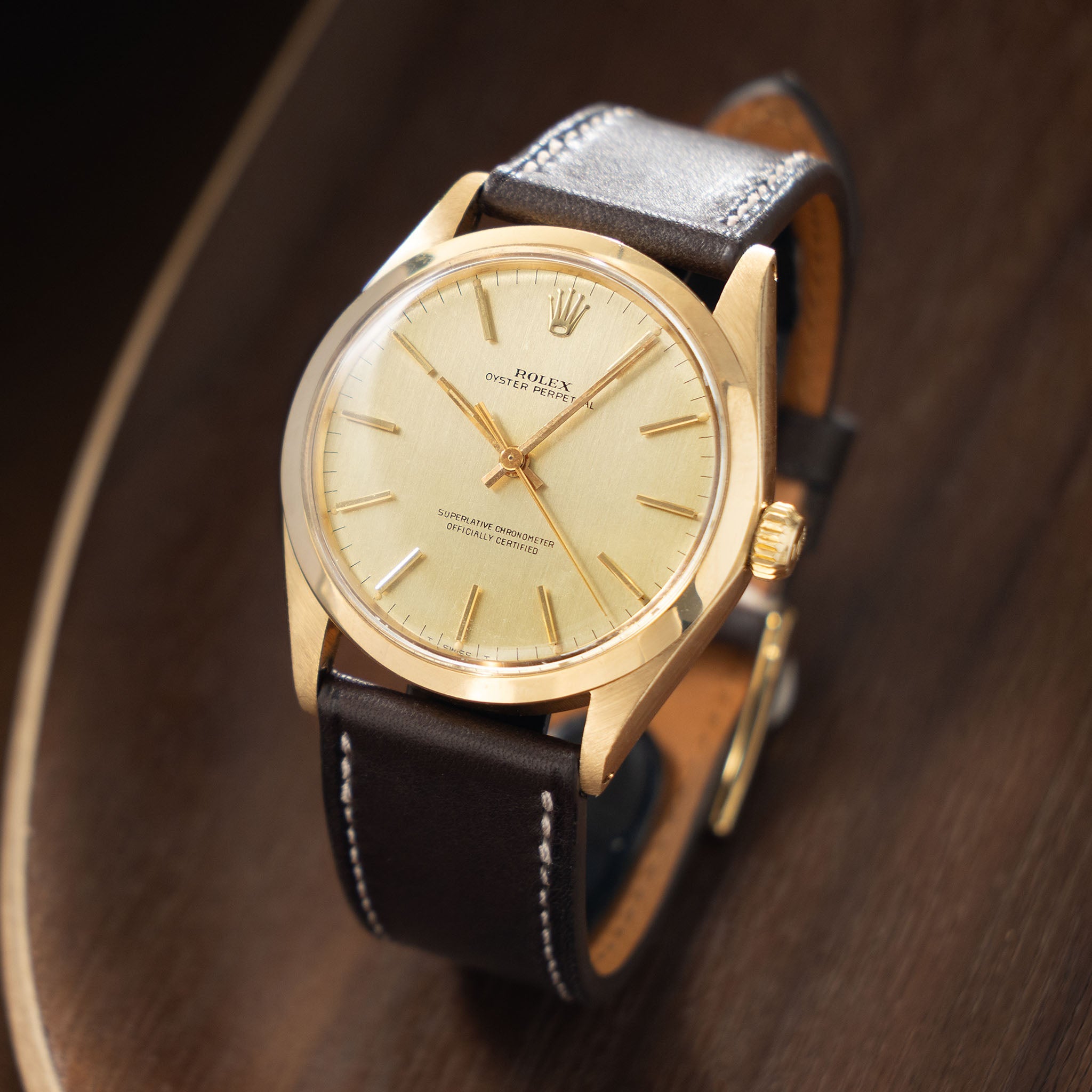 Rolex Oyster Perpetual 1002 Vertical Brush Champagne Dial in 18k Yellow Gold