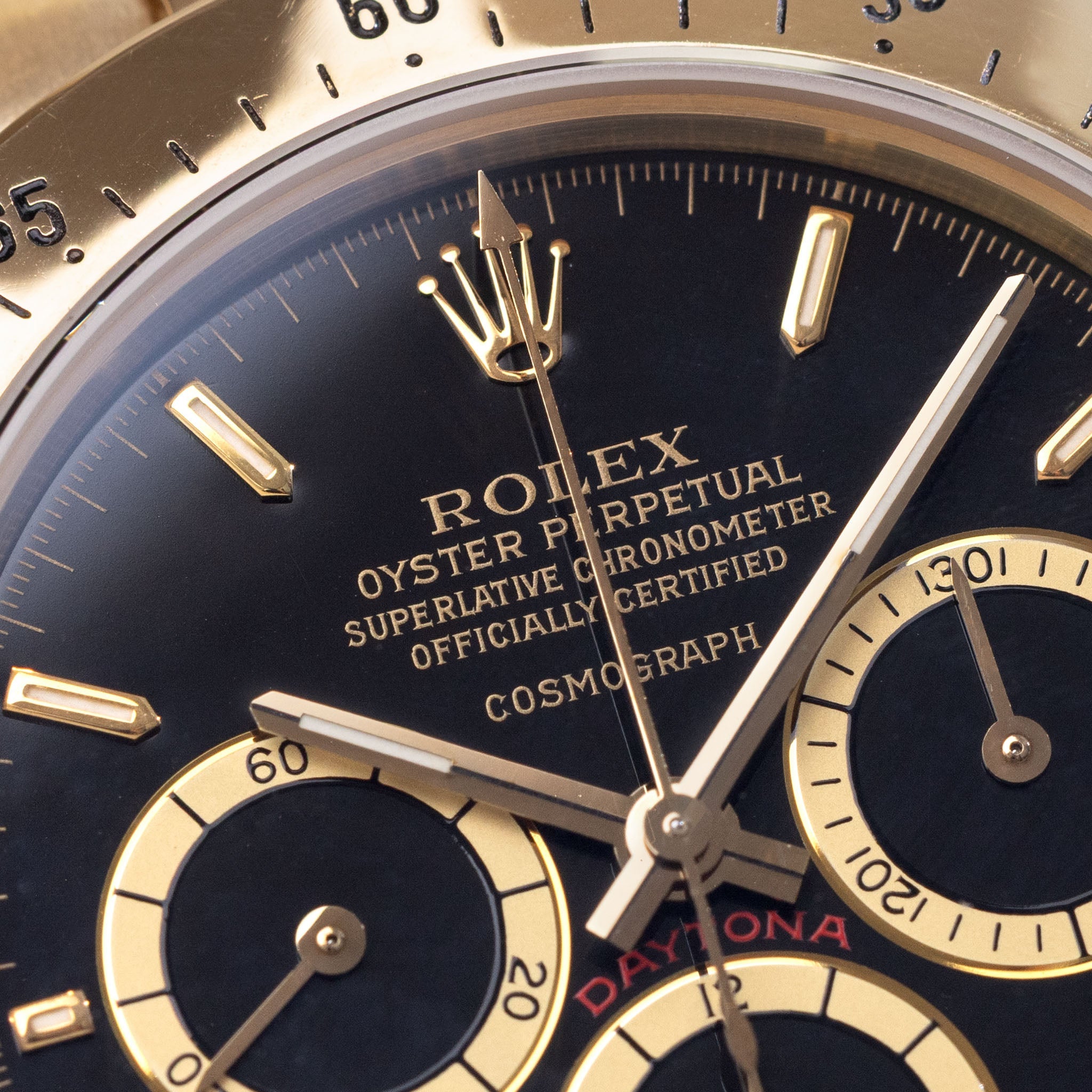 Rolex Cosmograph Daytona 16520 Black Floating Dial in 18k Yellow Gold with Original Guarantee Paper and Accessories
