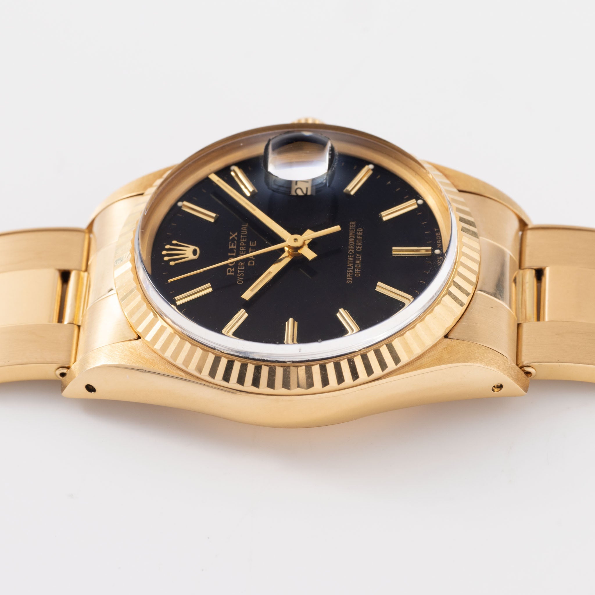 Rolex Oyster-perpetual date black dial  in 18 k yellow gold ref 15038